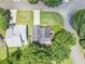 Aerial view of a home with a well-maintained lawn, mature trees, and a private backyard oasis in a serene setting at 10535 Willow Meadow Cir, Alpharetta, GA 30022