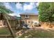 View of the backyard featuring a playset and patio area with outdoor furniture, perfect for Gathering gatherings at 10535 Willow Meadow Cir, Alpharetta, GA 30022
