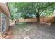 Spacious backyard with a playset, mature trees, and privacy fence at 10535 Willow Meadow Cir, Alpharetta, GA 30022