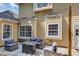 Back patio with outdoor seating and charming string lights at 10535 Willow Meadow Cir, Alpharetta, GA 30022