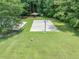 A community basketball court and picnic area surrounded by lush greenery, perfect for outdoor recreation and relaxation at 10535 Willow Meadow Cir, Alpharetta, GA 30022