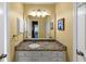 Stylish bathroom featuring granite countertops, a large mirror, and modern fixtures at 10535 Willow Meadow Cir, Alpharetta, GA 30022
