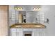 Spacious main bath with double sink vanity, granite countertops, and ample storage space at 10535 Willow Meadow Cir, Alpharetta, GA 30022