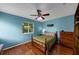 Comfortable bedroom with hardwood floors, natural light from window, and ample closet space at 10535 Willow Meadow Cir, Alpharetta, GA 30022