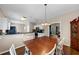 A dining room is open to the kitchen with stainless steel appliances at 10535 Willow Meadow Cir, Alpharetta, GA 30022