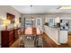 Cozy dining room featuring a wooden table and access to the kitchen and backyard at 10535 Willow Meadow Cir, Alpharetta, GA 30022