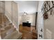 Entryway featuring stairs, hardwood floors, a ceiling fan, and a front door with hardware at 10535 Willow Meadow Cir, Alpharetta, GA 30022
