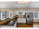Spacious kitchen featuring stainless steel refrigerator, and granite counters with sink at 10535 Willow Meadow Cir, Alpharetta, GA 30022