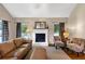 Comfortable living room with a fireplace, hardwood floors, and neutral wall colors and furnishings at 10535 Willow Meadow Cir, Alpharetta, GA 30022