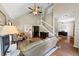 Open-concept living room with hardwood floors, a vaulted ceiling, and a staircase at 10535 Willow Meadow Cir, Alpharetta, GA 30022