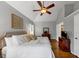 Inviting main bedroom with vaulted ceiling, hardwood floors, ceiling fan, and neutral color palette at 10535 Willow Meadow Cir, Alpharetta, GA 30022