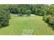 Expansive recreation field featuring a volleyball net, soccer goals, and basketball court, promoting active outdoor fun at 10535 Willow Meadow Cir, Alpharetta, GA 30022