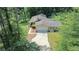 Aerial view of a single-story home with attached garage and private lot at 180 Bishop Nw Rd, Cartersville, GA 30121