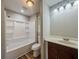 Bathroom featuring a shower and tub, sink and vanity, toilet, and good natural light at 180 Bishop Nw Rd, Cartersville, GA 30121