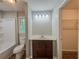 Bathroom featuring a sink and vanity, toilet, bath tub, and window with natural light at 180 Bishop Nw Rd, Cartersville, GA 30121