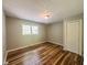 Bedroom featuring wood flooring, natural light, and closet at 180 Bishop Nw Rd, Cartersville, GA 30121