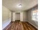 Bedroom featuring wood flooring, large window and closet at 180 Bishop Nw Rd, Cartersville, GA 30121