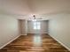 Spacious bedroom featuring wood flooring and a ceiling fan at 180 Bishop Nw Rd, Cartersville, GA 30121