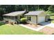 Well-maintained single-story home with an attached garage and a manicured lawn at 180 Bishop Nw Rd, Cartersville, GA 30121