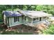 Well-maintained single-story home featuring a covered front porch, rear deck, and mature landscaping at 180 Bishop Nw Rd, Cartersville, GA 30121