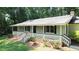 Charming single-story home featuring an inviting front porch with brick accents at 180 Bishop Nw Rd, Cartersville, GA 30121