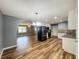 Open kitchen featuring stainless steel appliances, granite countertops, and seamless access to the living area at 180 Bishop Nw Rd, Cartersville, GA 30121