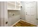 Laundry room includes utility connections and shelving at 180 Bishop Nw Rd, Cartersville, GA 30121