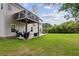Outdoor living space with a deck and patio that provides ample room for entertaining and relaxation in the lush, green backyard at 2140 Hurt Sw Rd, Marietta, GA 30008