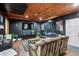 Finished basement with paneled accent wall, movie posters, large TV, and comfortable seating at 2140 Hurt Sw Rd, Marietta, GA 30008
