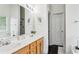 Bathroom featuring double sinks, large mirror, and modern fixtures at 2140 Hurt Sw Rd, Marietta, GA 30008