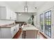 Bright dining area with white cabinets and hardwood floors open to living area at 2140 Hurt Sw Rd, Marietta, GA 30008