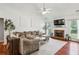 Bright living room with vaulted ceiling, fireplace, and comfortable seating at 2140 Hurt Sw Rd, Marietta, GA 30008
