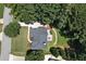 Top-down aerial view of home showcasing backyard deck, stone walkway, and lush landscaping at 2832 Windrush Dr, Buford, GA 30518