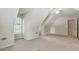 Finished attic with dormers, neutral walls, and carpet at 2832 Windrush Dr, Buford, GA 30518