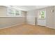 View of the basement featuring tile floors and a white door to the exterior at 2832 Windrush Dr, Buford, GA 30518