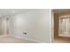 View of the basement featuring carpet floors, drop ceiling, and neutral decor at 2832 Windrush Dr, Buford, GA 30518