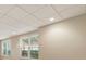 View of the basement featuring drop ceiling, recessed lighting, and window at 2832 Windrush Dr, Buford, GA 30518