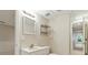 View of the basement bathroom with a single sink vanity and a wall mirror at 2832 Windrush Dr, Buford, GA 30518