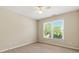 Bedroom with neutral walls and carpet with a window providing natural light at 2832 Windrush Dr, Buford, GA 30518
