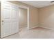 Bedroom featuring neutral carpet and a 5-panel door at 2832 Windrush Dr, Buford, GA 30518