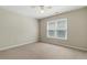 Bedroom with carpet, neutral walls, and a large window providing natural light at 2832 Windrush Dr, Buford, GA 30518