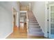 View of the foyer area with stairs and hardwood flooring at 2832 Windrush Dr, Buford, GA 30518