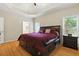 Spacious main bedroom with a tray ceiling and hardwood floors at 2832 Windrush Dr, Buford, GA 30518