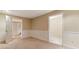 View of the basement room featuring carpet, a door to the bathroom, and neutral paint at 2832 Windrush Dr, Buford, GA 30518