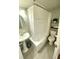 Classic bathroom featuring tiled floors, a vanity sink, and a shower with a tub at 300 Peachtree Ne St # 11I, Atlanta, GA 30308