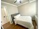 Cozy bedroom featuring hardwood floors and a comfortable bed with white linens at 300 Peachtree Ne St # 11I, Atlanta, GA 30308