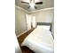 Bright bedroom with hardwood floors, ceiling fan, and a comfortable bed with white linens at 300 Peachtree Ne St # 11I, Atlanta, GA 30308