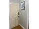 Apartment entrance featuring a light-colored door, modern lock, and neutral wall color at 300 Peachtree Ne St # 11I, Atlanta, GA 30308