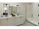 Elegant bathroom with double vanity, quartz countertop, sleek fixtures, and a glass-enclosed shower at 947 Willingham Dr # 2, Hapeville, GA 30354