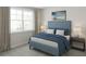 Relaxing bedroom with a cozy bed, soft lighting, and a large window overlooking the outdoors at 947 Willingham Dr # 2, Hapeville, GA 30354
